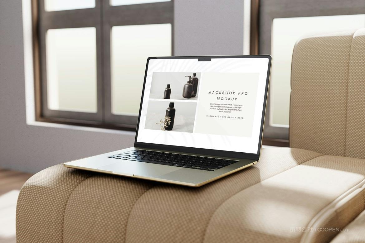 放在沙发上的笔记本电脑场景样机
