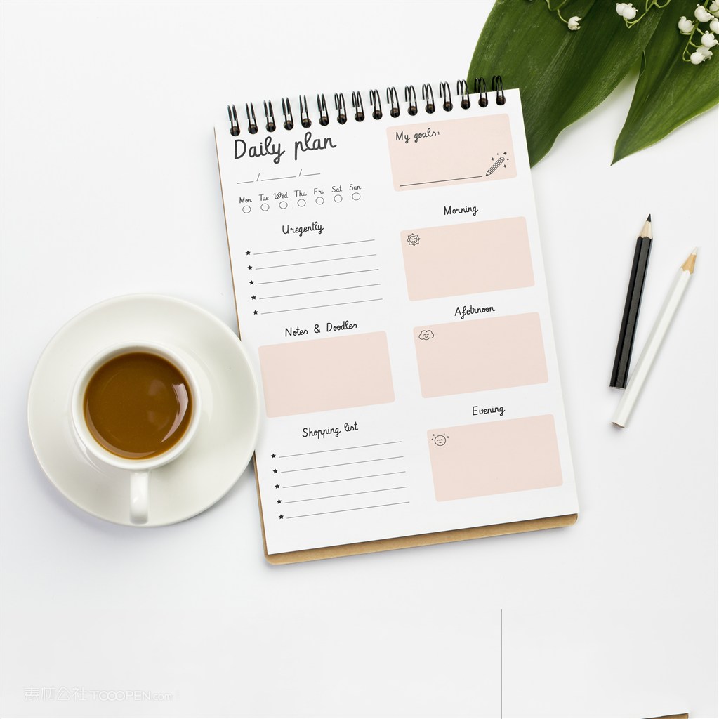 咖啡杯旁边的笔记本贴图样机