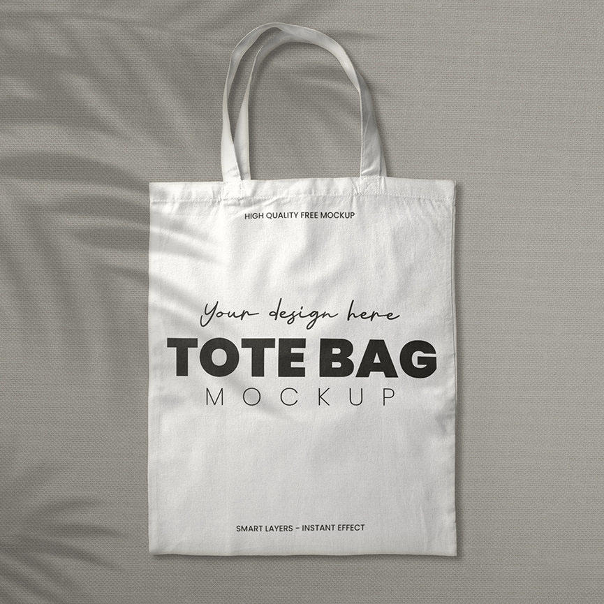 灰色麻布底纹背景上的环保袋logo样机