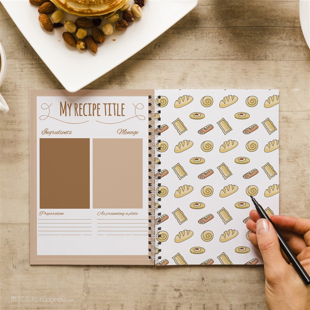 手拿笔正在笔记本上写字贴图样机