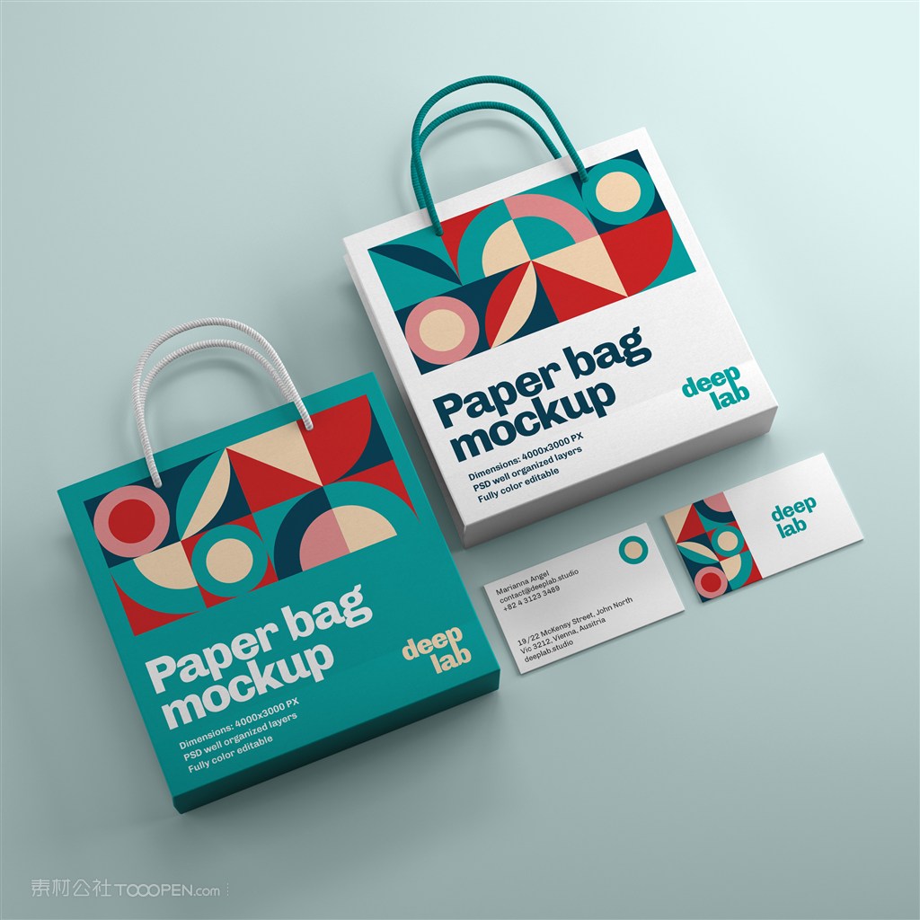 平放在蓝色背景上的手提袋名片贴图样机