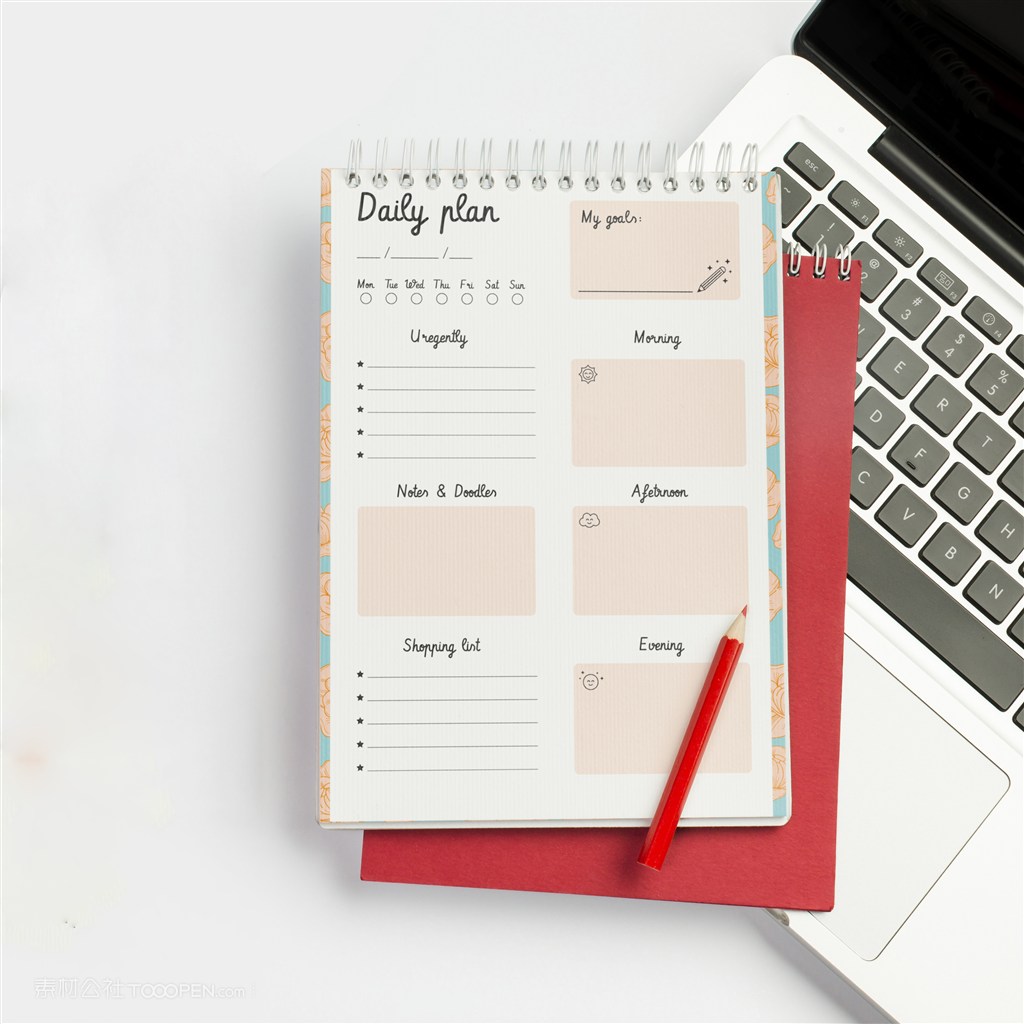 咖啡杯旁边红色笔记本贴图样机