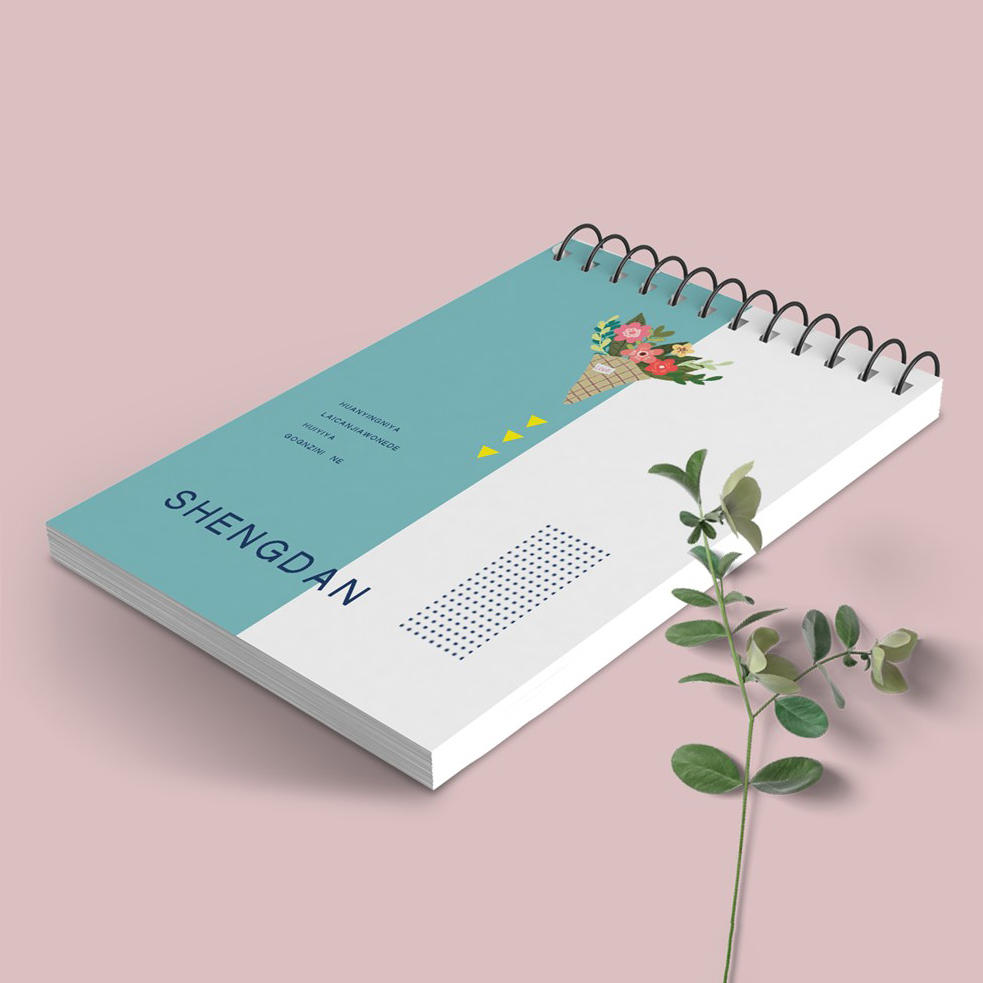 粉嫩简约背景上螺旋拉环笔记本样机